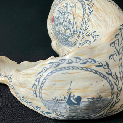 Sperm whale sculpture with hand-painted scrimshaw design.  American maritime art.