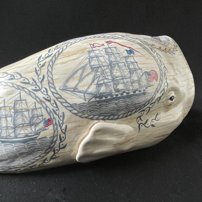 Sperm whale sculpture with hand-painted scrimshaw design.  American maritime art.