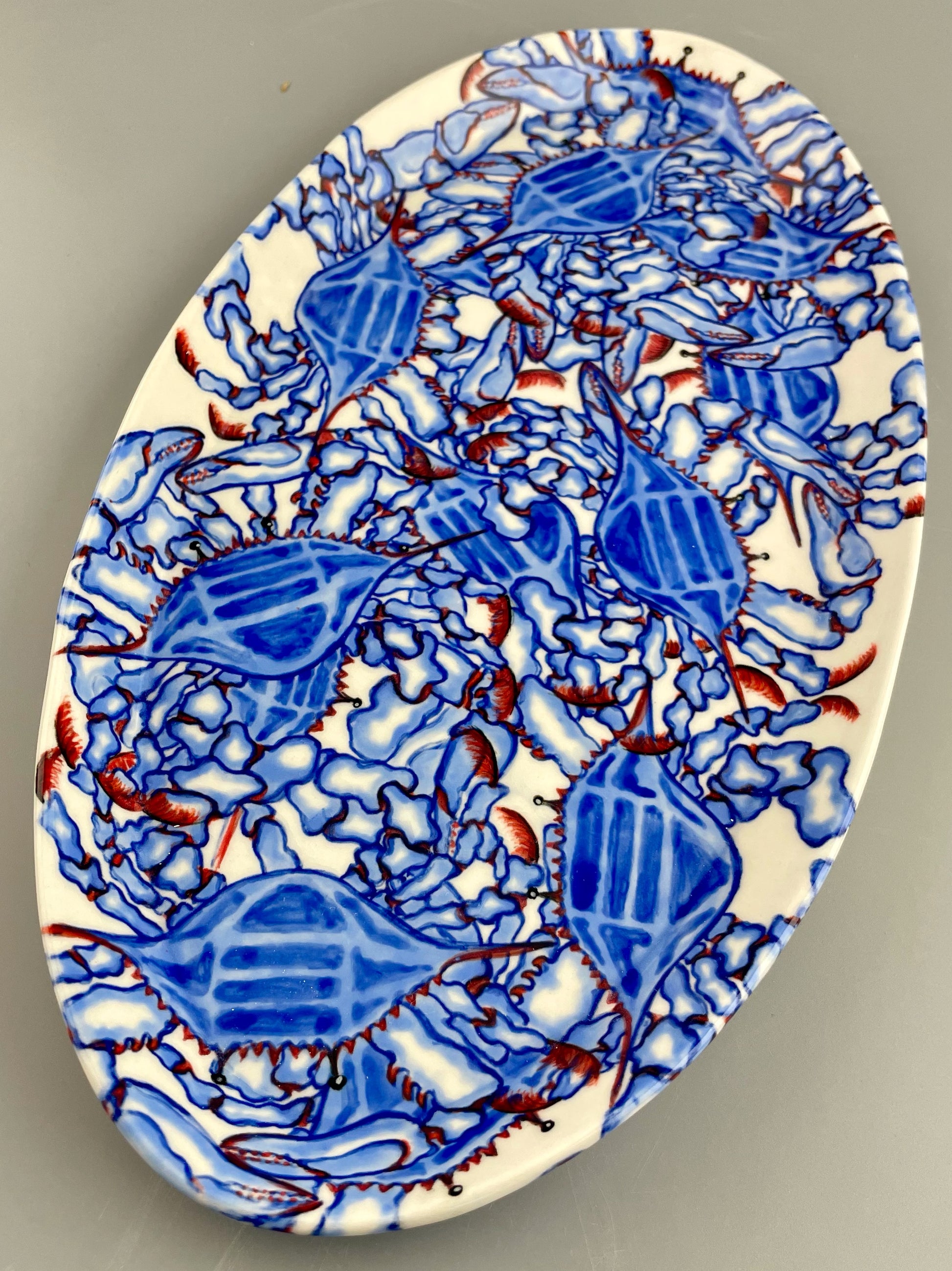 Hand-crafted porcelain platter with blue crab design