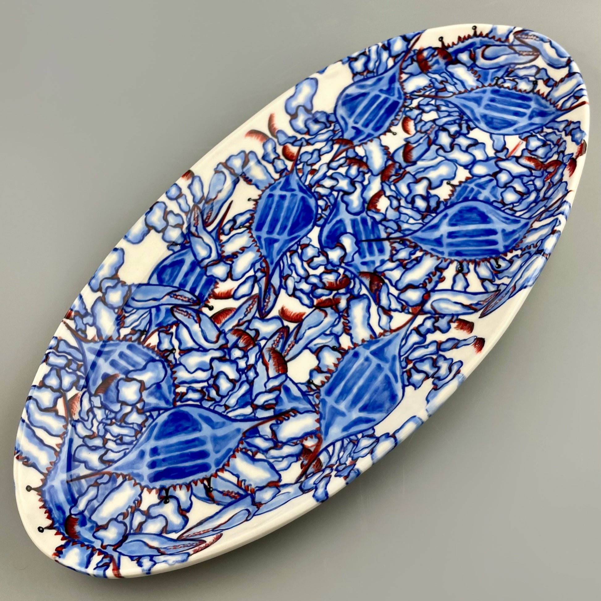 Hand-crafted porcelain platter with blue crab design