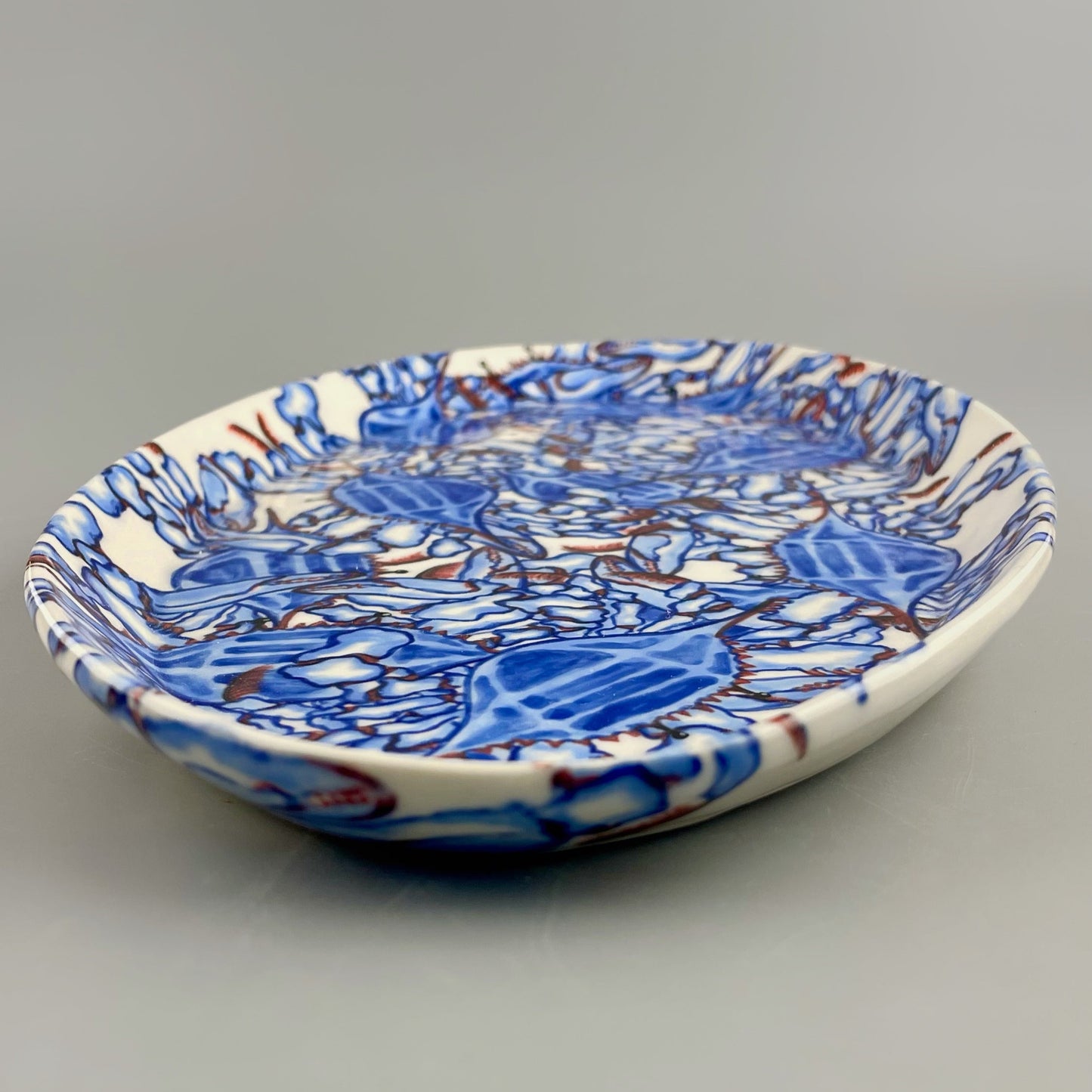 Hand-crafted porcelain platter with blue crab design