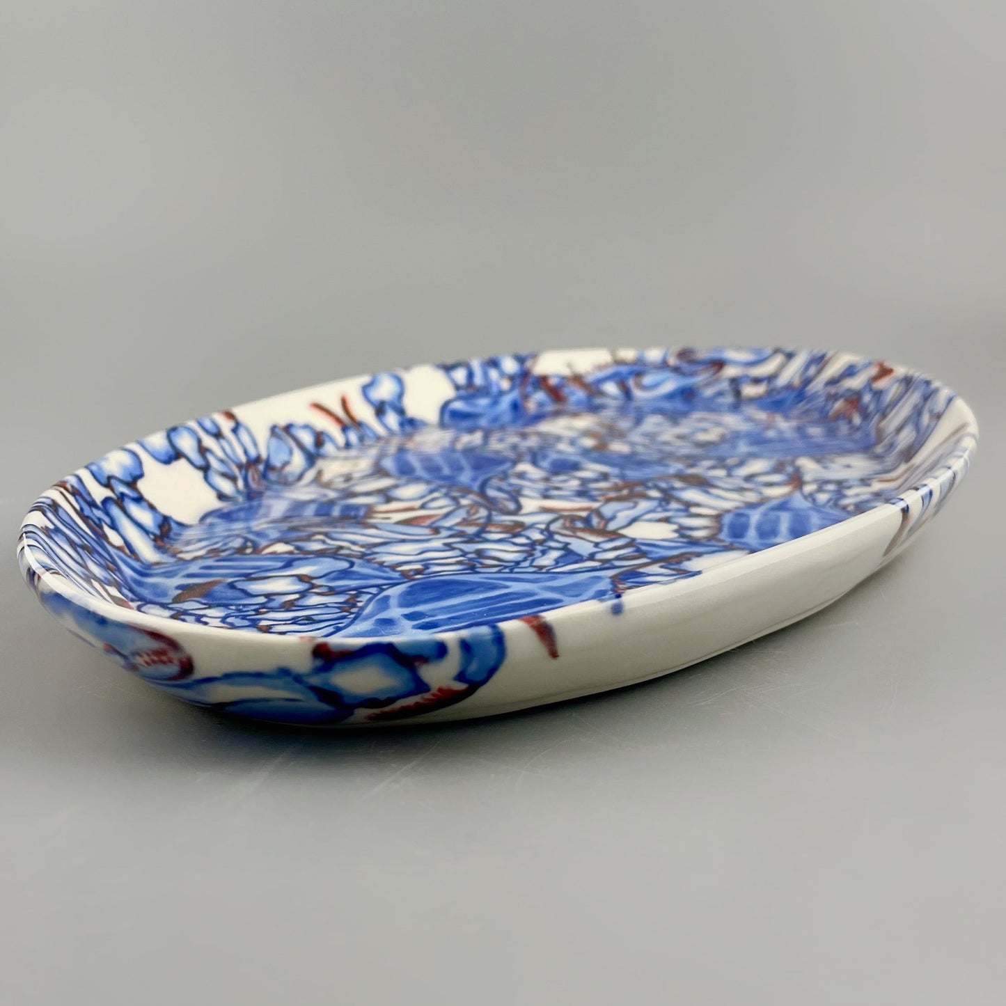 Hand-crafted porcelain platter with blue crab design