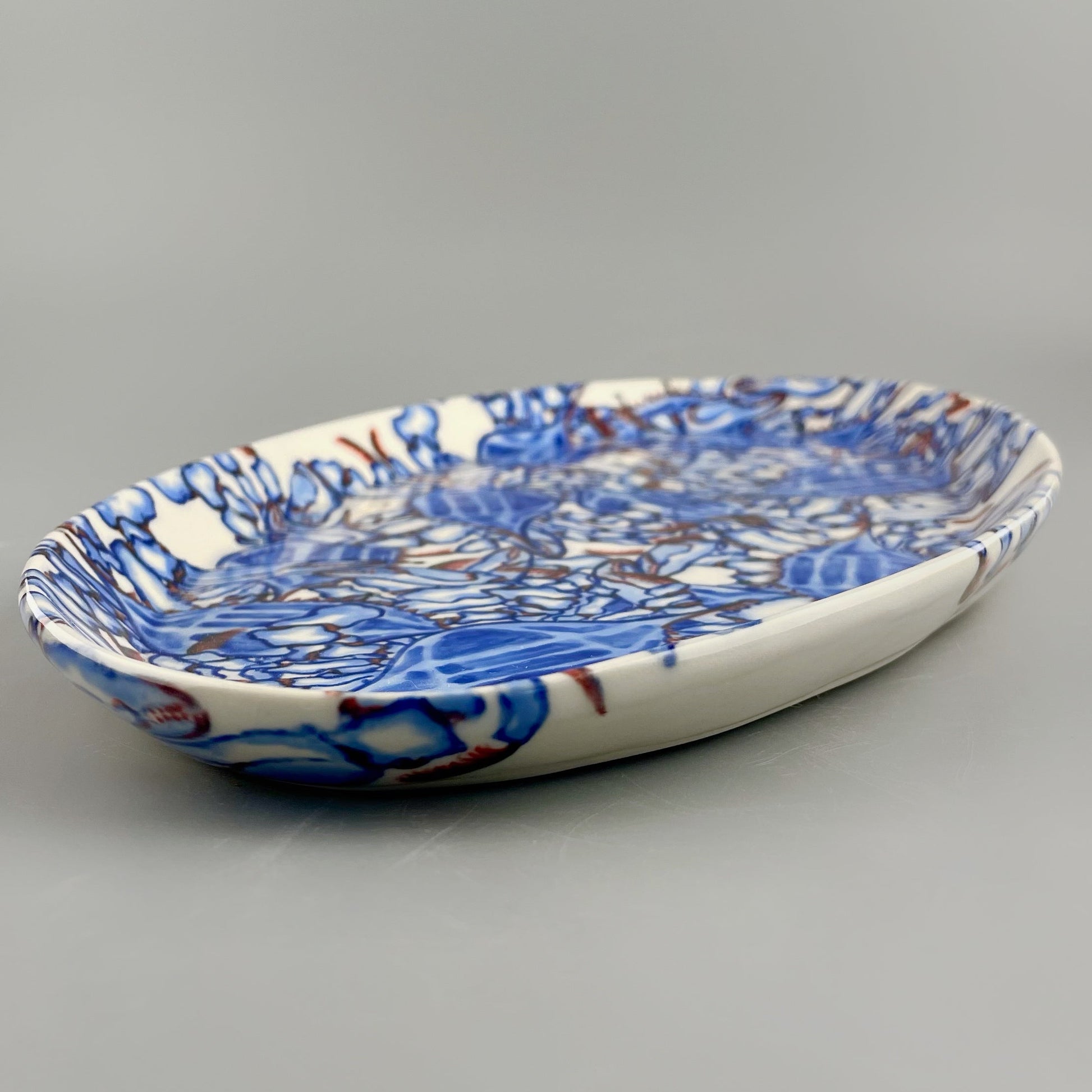 Hand-crafted porcelain platter with blue crab design
