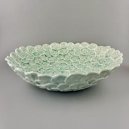 Hand-crafted porcelain bowl with sand dollars