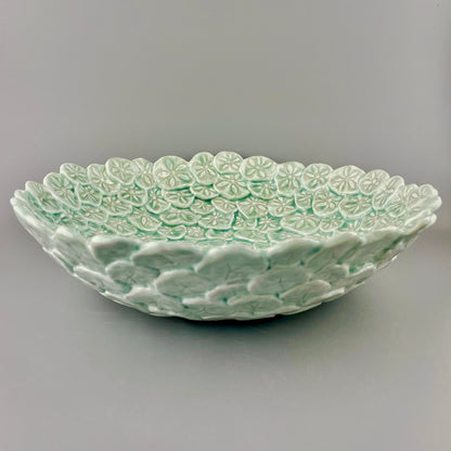 Hand-crafted porcelain bowl with sand dollars