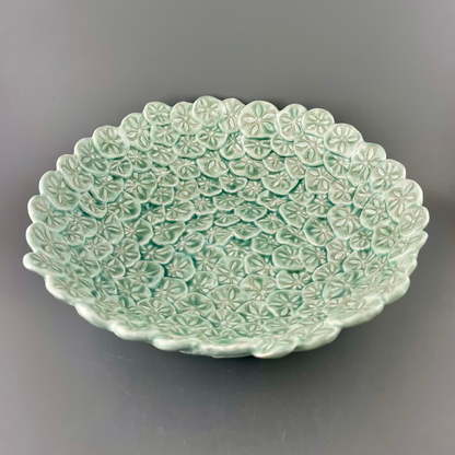 Hand-crafted porcelain bowl with sand dollars
