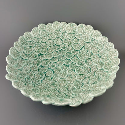 Hand-crafted porcelain bowl with sand dollars
