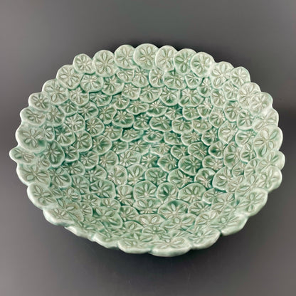 Hand-crafted porcelain bowl with sand dollars