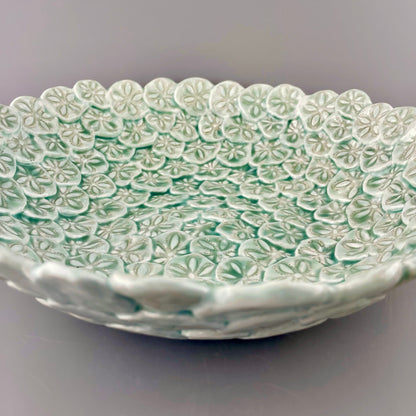 Hand-crafted porcelain bowl with sand dollars