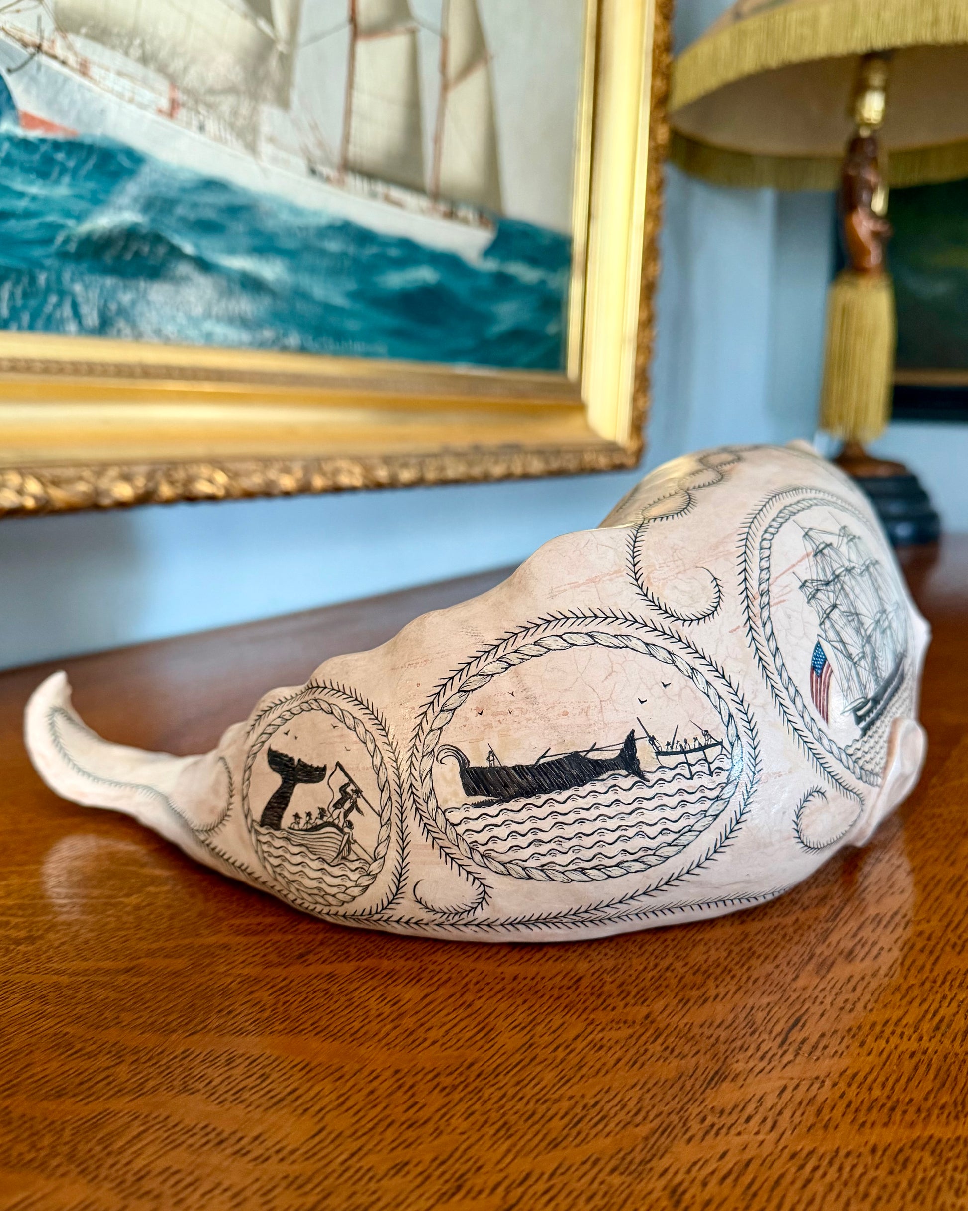 Sperm whale sculpture with scrimshaw design.  American maritime art.