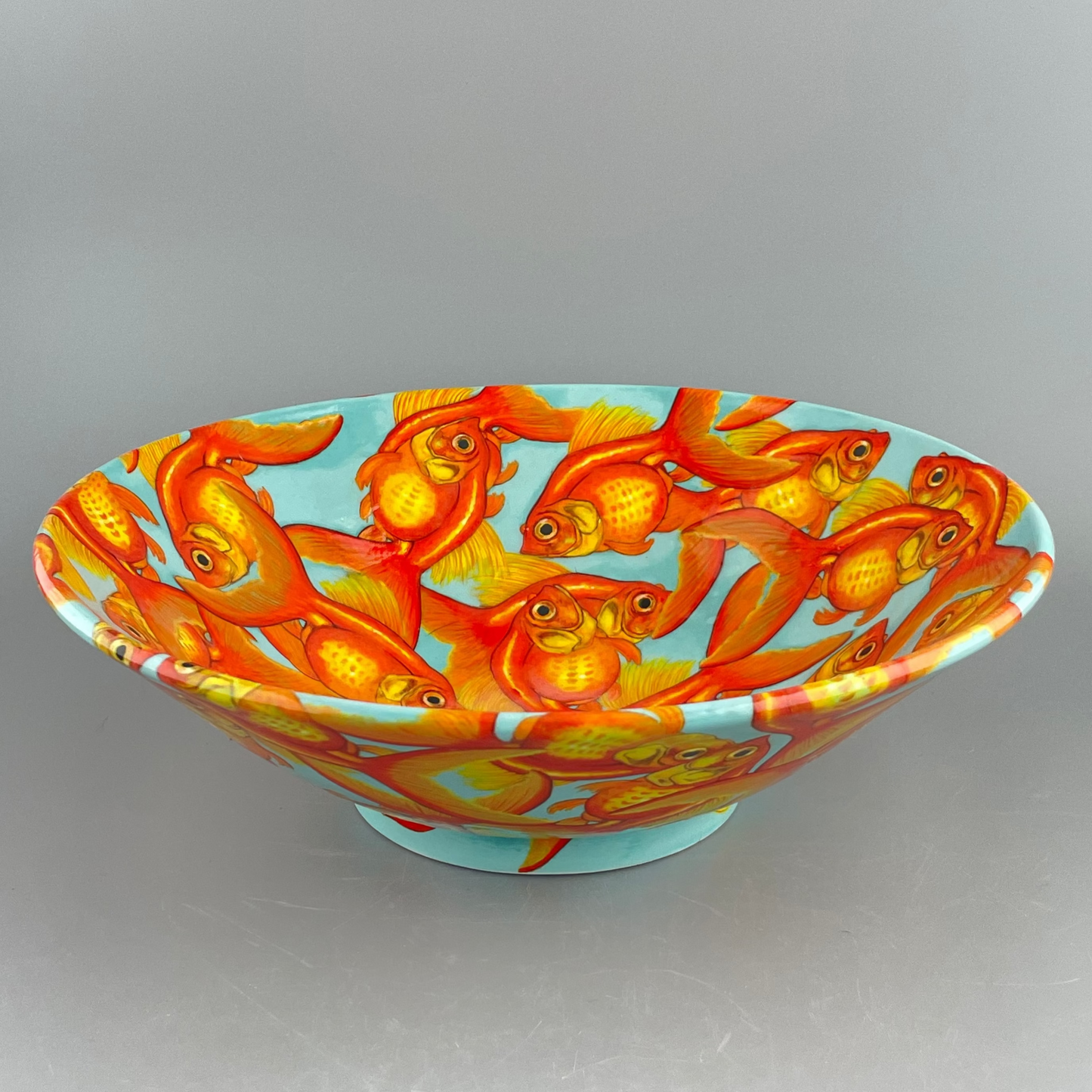 Porcelain bowl with hand-painted goldfish design