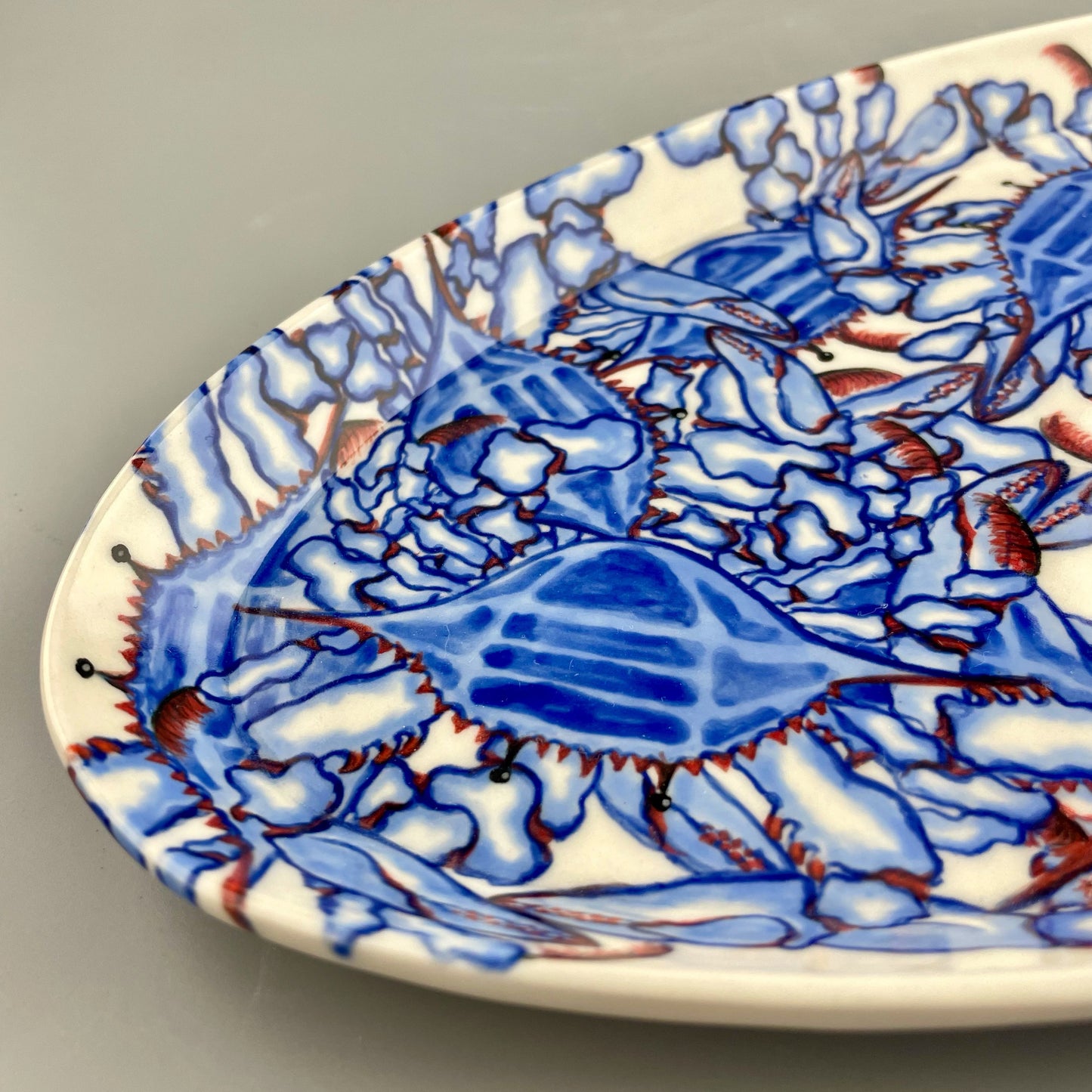Hand-crafted porcelain platter with blue crab design