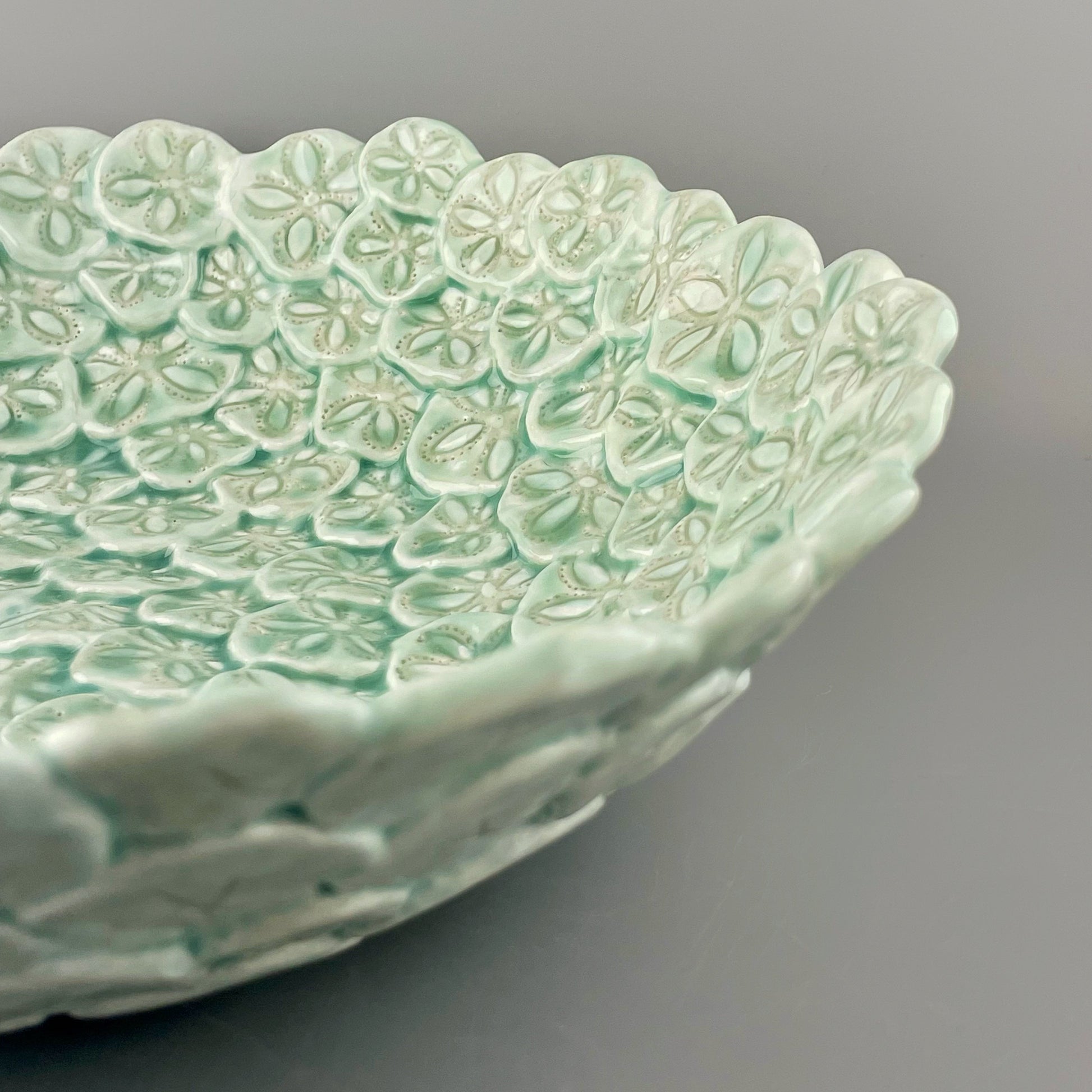 Hand-crafted porcelain bowl made with sculpted sand dollars or sea biscuits 