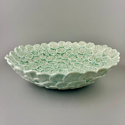 Hand-crafted porcelain bowl with sand dollars