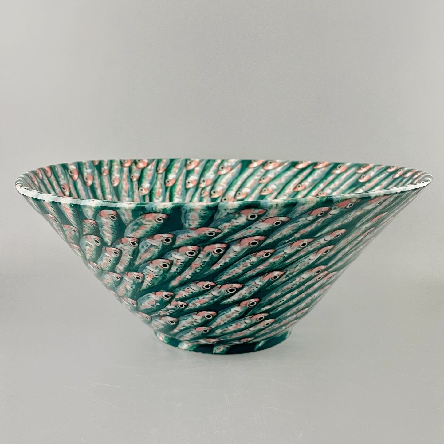 Hand crafted porcelain bowl with swimming sardines