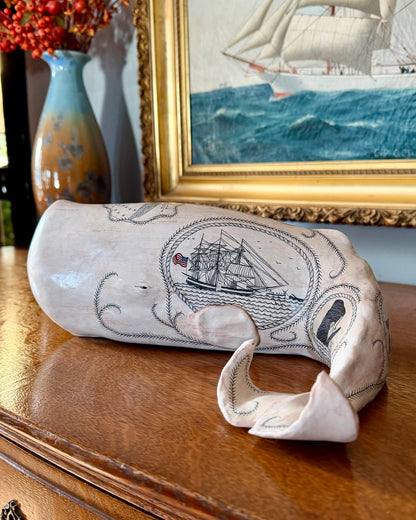 Sperm whale sculpture with scrimshaw design by Laura Rotelli.  Iconic Americana Maritime artwork for nautical and coastal decor