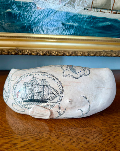 Sperm whale sculpture with scrimshaw design.  American maritime art.
