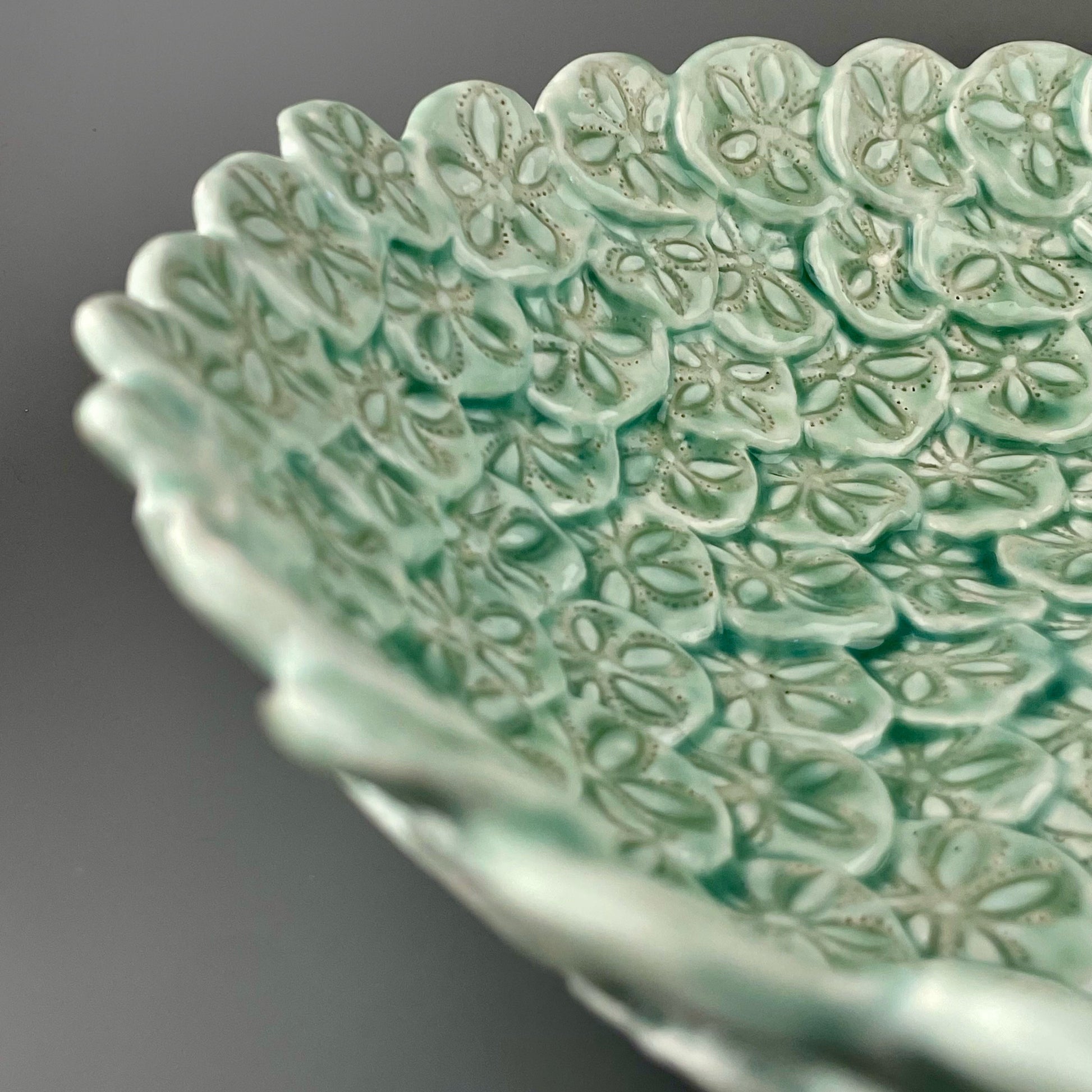 Hand-crafted porcelain bowl made with sculpted sand dollars or sea biscuits 