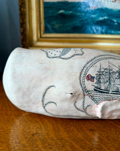Sperm whale sculpture with scrimshaw design.  American maritime art.